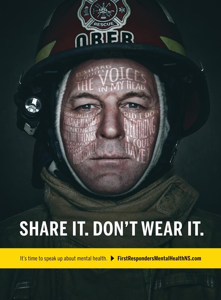 Close-up photograph of a Firefighter with text over the image mentioning "Share It. Don't Wear It.