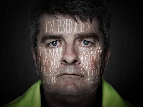Photograph of a paramedic looking tense. White text covers his face, listing frustrations about work, marriage, children, exhaustion, and feeling overwhelmed, conveying stress reaching a breaking point