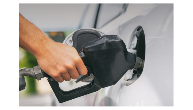 A person filling gas in their car at the gas station