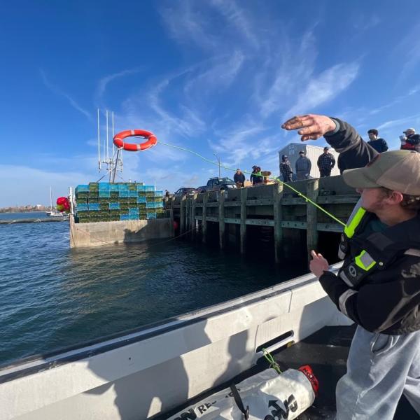 A Wharfside safety demonstration in Yarmouth NS shows a life ring deployment to promote safety on the water