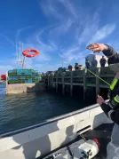 A Wharfside safety demonstration in Yarmouth NS shows a life ring deployment to promote safety on the water