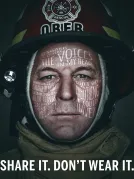 Close-up photograph of a Firefighter with text over the image mentioning "Share It. Don't Wear It.