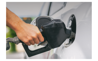 A person filling gas in their car at the gas station