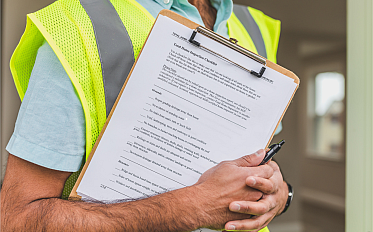 Worker with a safety checklist