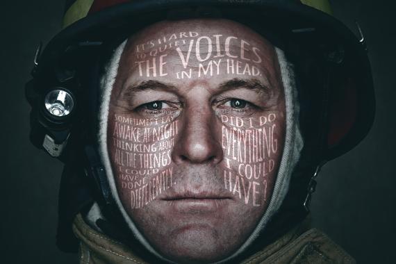 Close-up photograph of a Firefighter with text over the image mentioning "Share It. Don't Wear It.